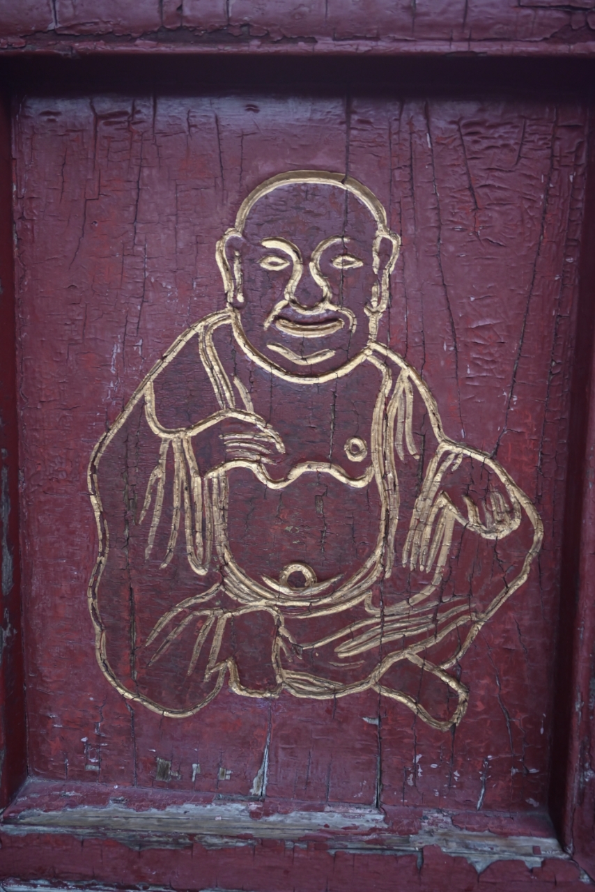 Carved buddha panel