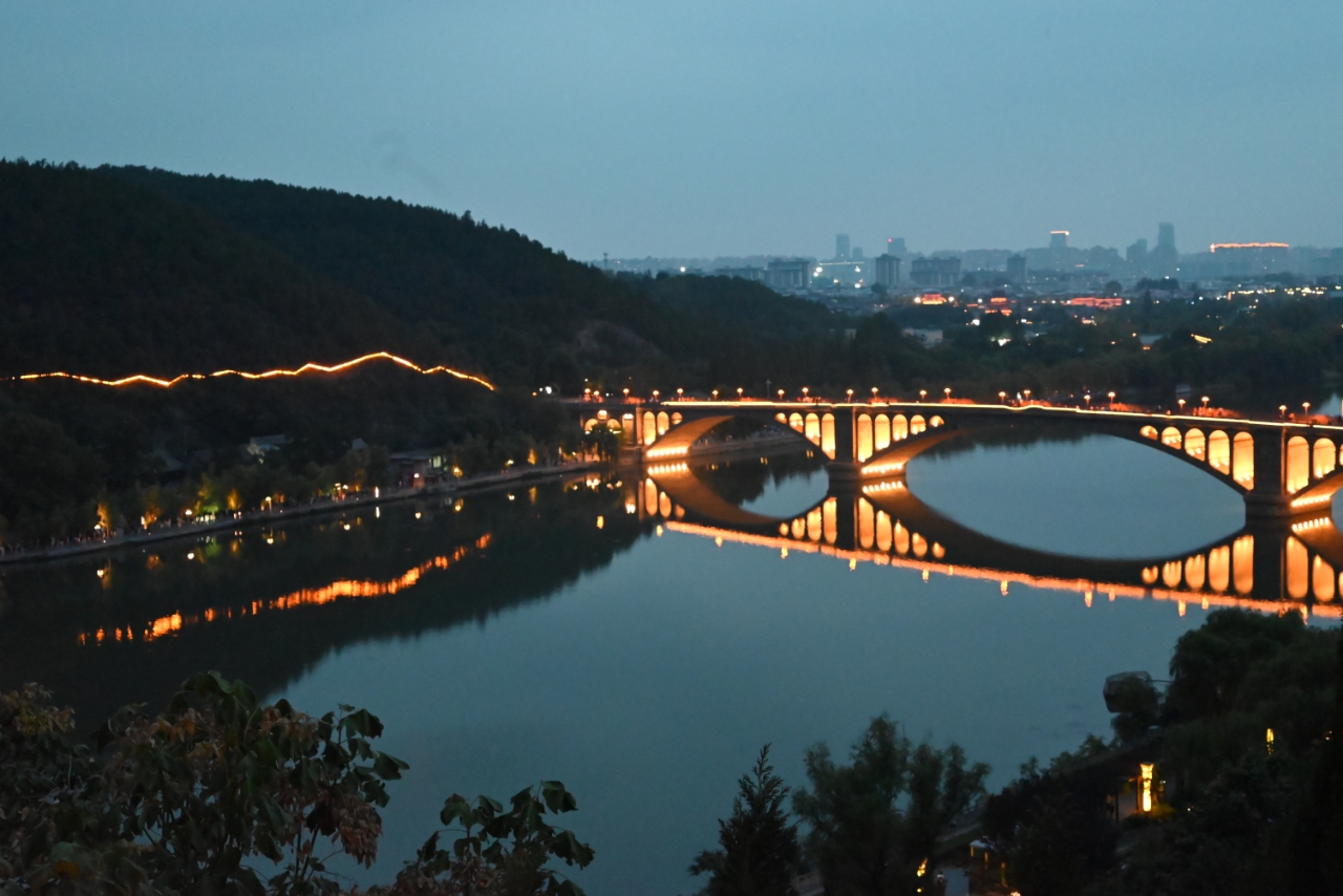 Illuminated bridge at dusk